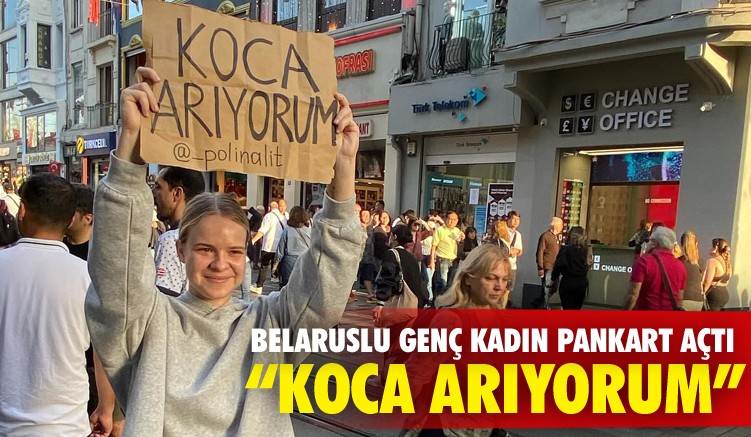 Belaruslu genç kadın pankartla koca aradı!