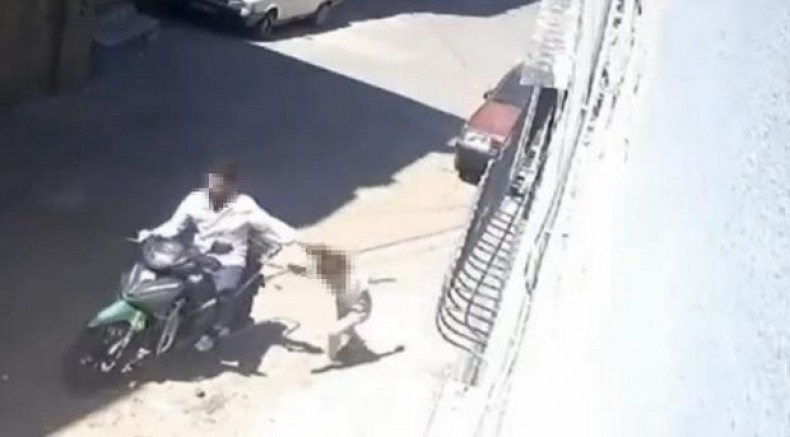 Kızını darbedip motosikletle sürükleyen baba gözaltında
